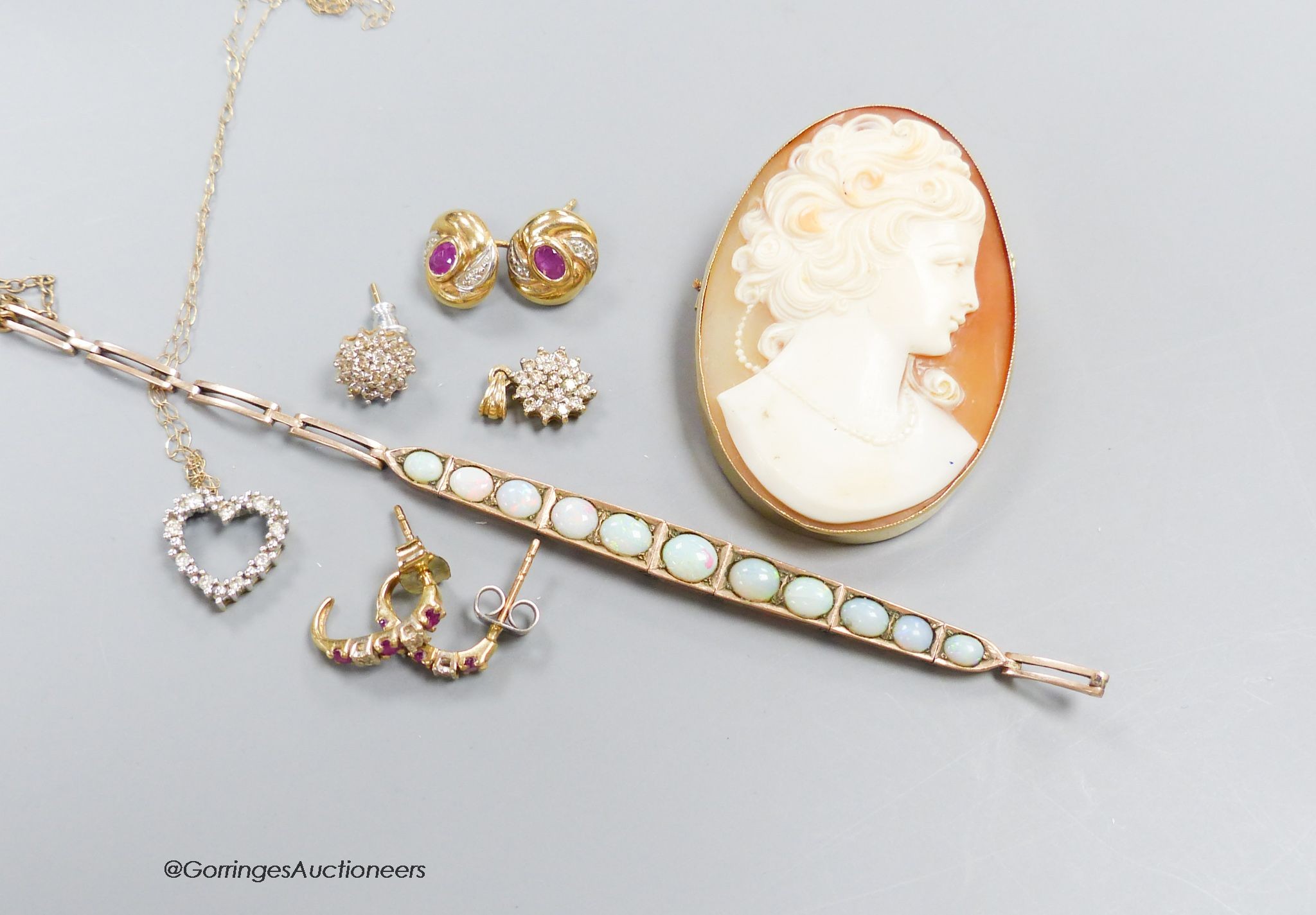 A gold and white opal bracelet (a.f), a cameo brooch and sundry gem set earrings and pendants